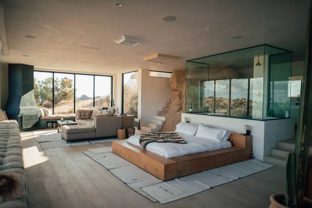 A hotel room with a seating area